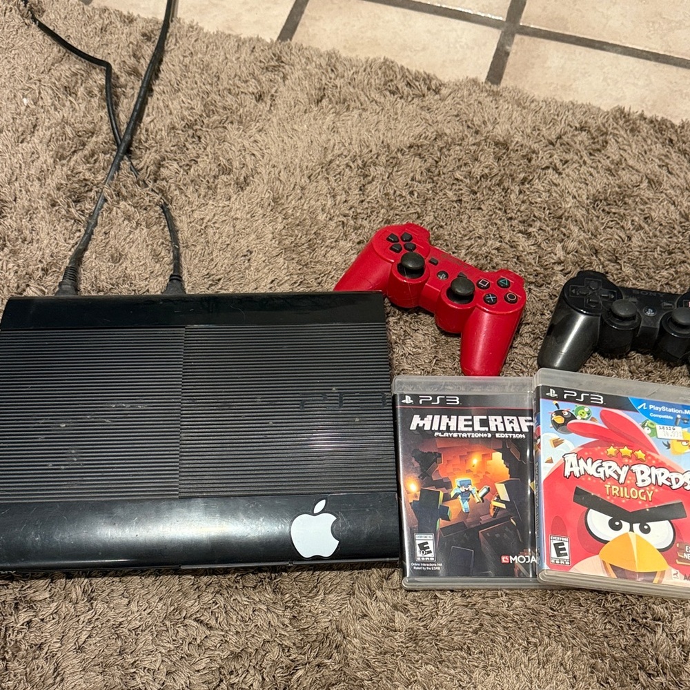 Sony PS3 Slim Console with Red and Black DualShock Controllers and Games